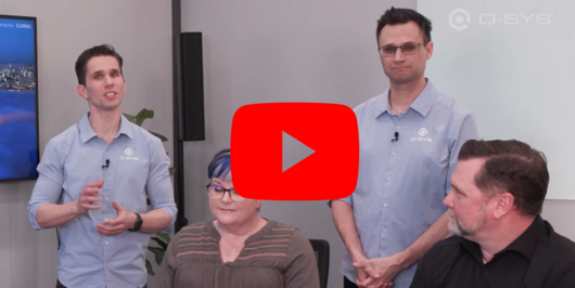 Video thumbnail of QSC employees giving a demo if a Q-SYS Zoom Room