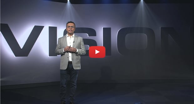 Video thumbnail of a man on a stage introducing Q-SYS Visionsuite