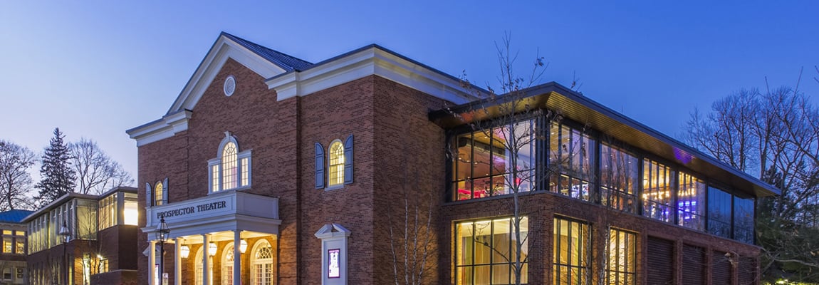 Outside view of the Prospector Theater during a sunset