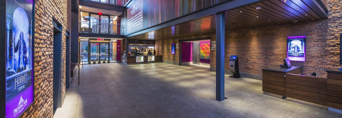 View inside the Prospector Theater with movie posters on the walls