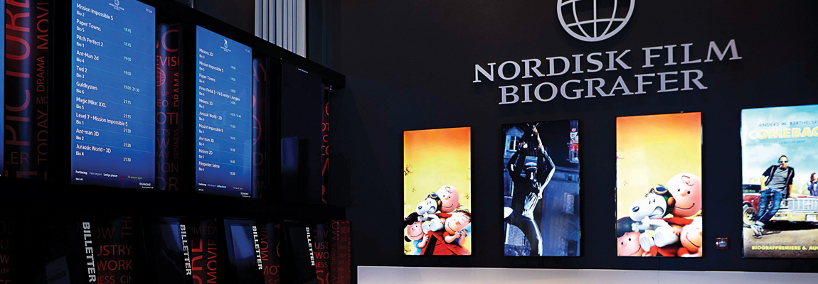 View of digital ticket booths and movie posters at Nordisk Film’s multi-level Cineplex