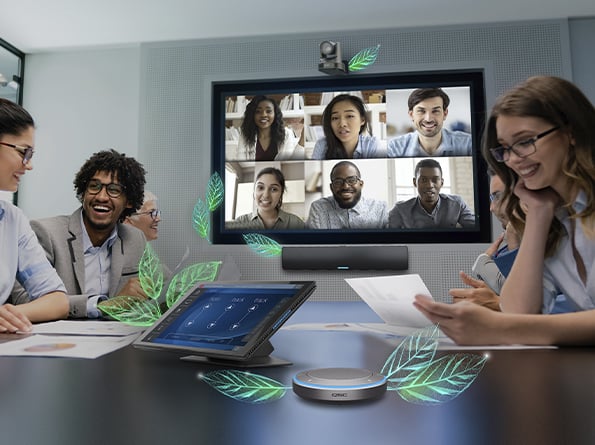 Image of a conference room showcasing various Q-SYS products with artistically drawn leaves sprouting, and individuals talking.