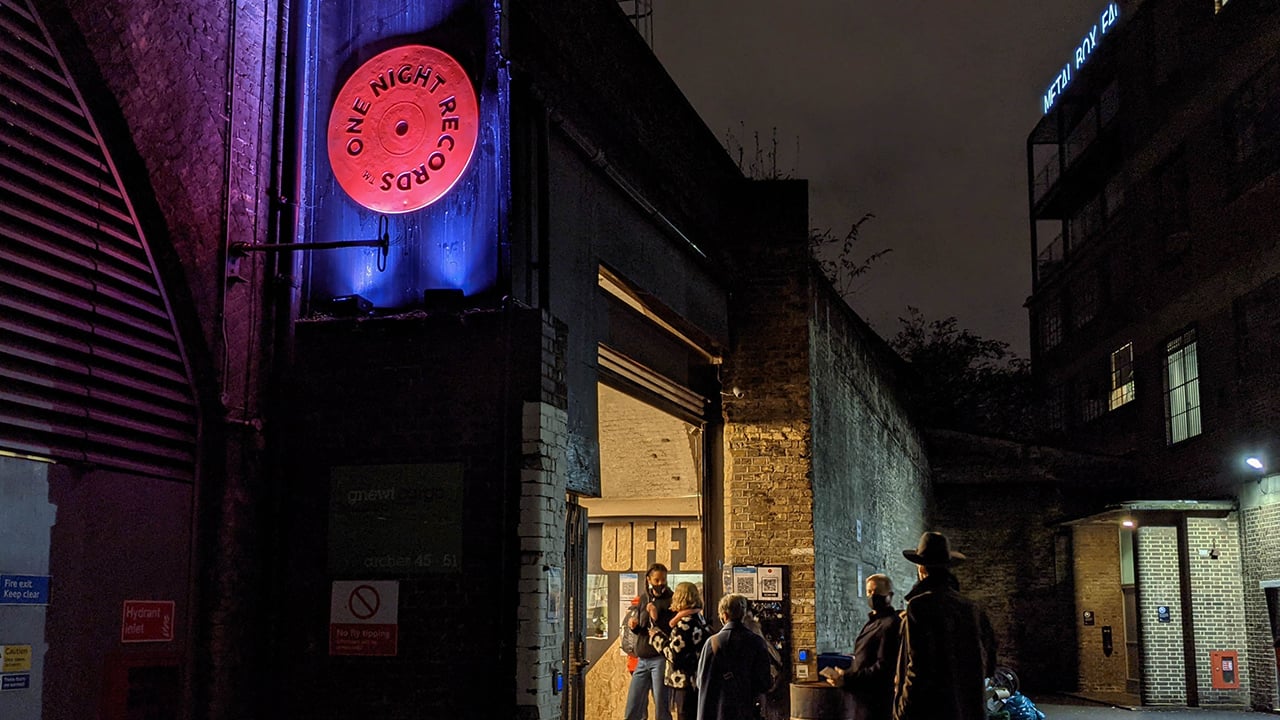 Outside shot of One Night Records entrance at night