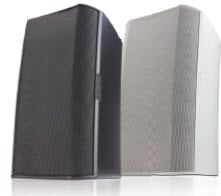 Front left-angled view of two QSC surface mounted loudspeakers in back and white color