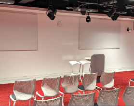 Video thumbnail of a tech talk room with empty chairs