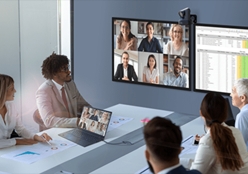 Image of people sitting around conference room table