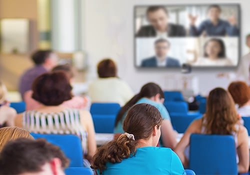 Image of people watching a screen in a classroom