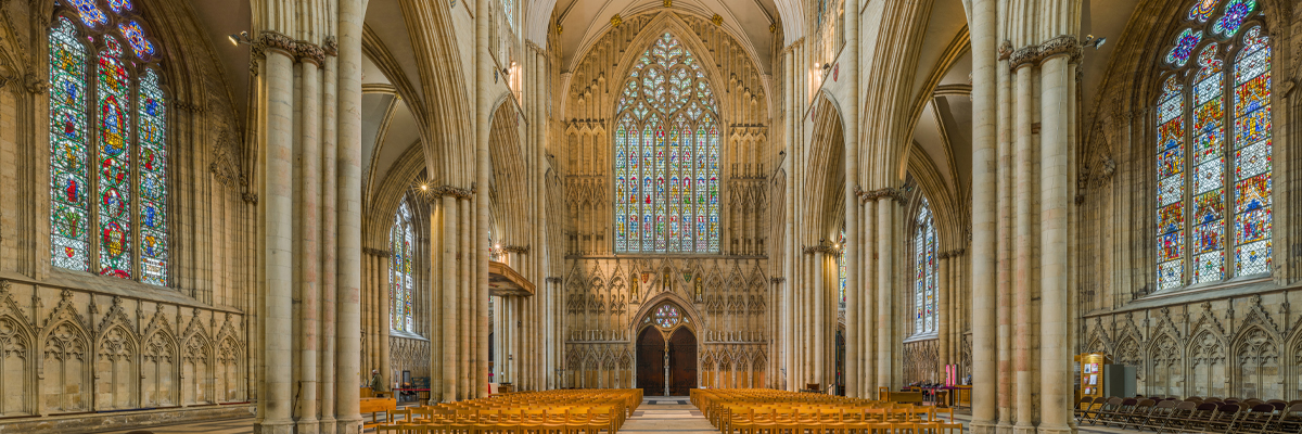 View inside the architecturally grand York Minister with stained glass  along the walls
