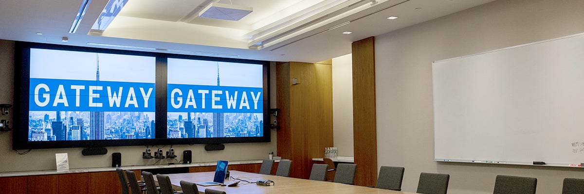 A large board room featuring Q-SYS hardware and peripherals at the Gateway headquarters