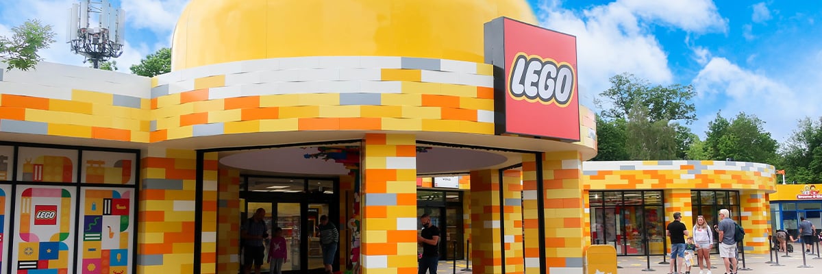 A Yellow LEGO building that looks as if it was made out of Lego bricks