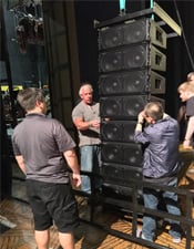 QSC’s Jon Graves inspect the array angle before it gets hoisted into position