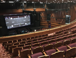 Twenty-three QSC SR-1590 surround loudspeakers were suspended from truss above the audience for Dolby Atmos immersive sound